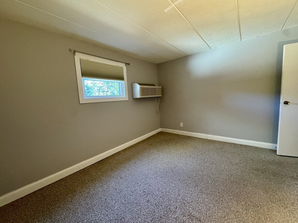 147 Turner Road, Unit 80 Holliston, MA 01746 - Photo 11 of 22 a view of an empty room with a window