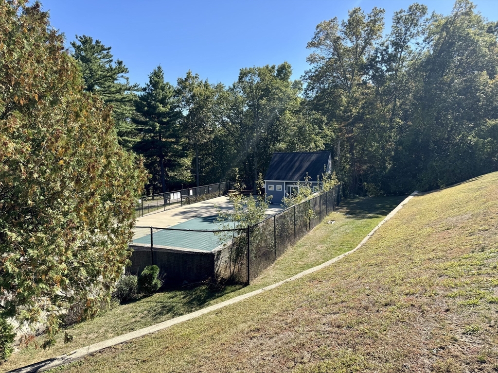 147 Turner Road, Unit 80 Holliston, MA 01746 - Photo 20 of 22 a view of a backyard with chairs and potted plants