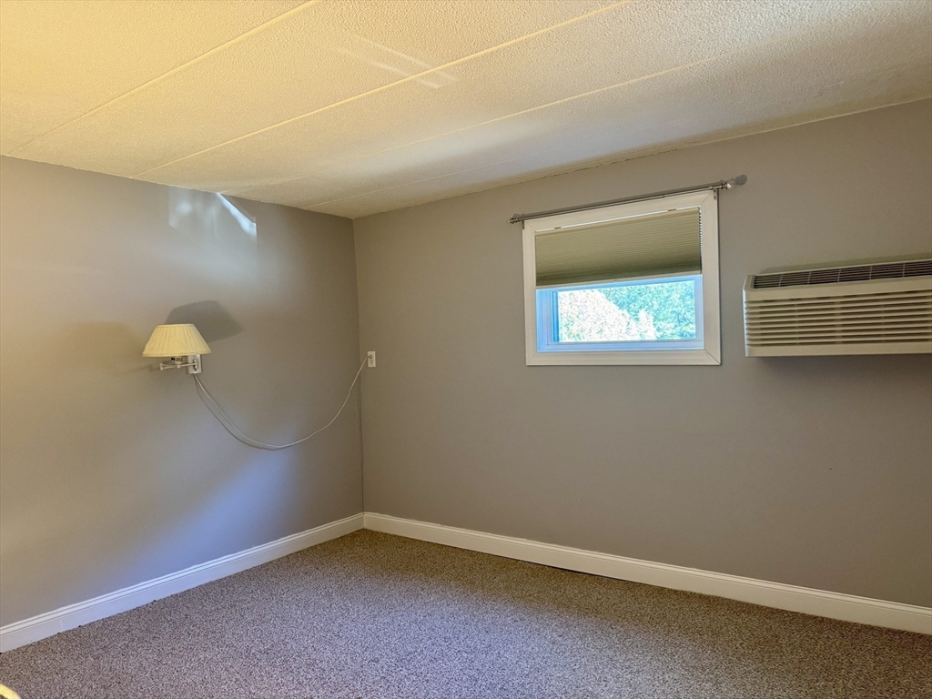 147 Turner Road, Unit 80 Holliston, MA 01746 - Photo 6 of 22 an empty room with a window