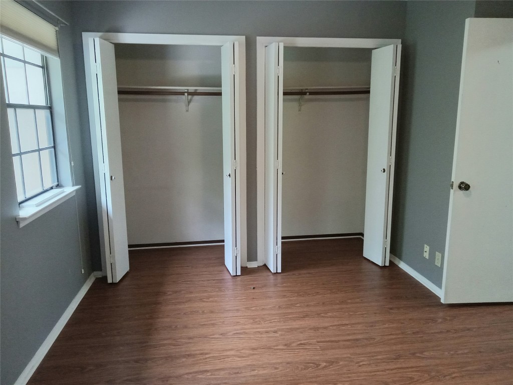 910 East Meadowmere Lane Austin, TX 78758 - Photo 18 of 27 an empty room with wooden floor & closet area