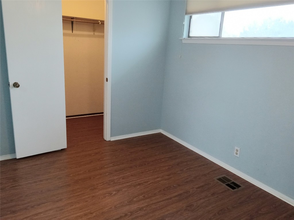 910 East Meadowmere Lane Austin, TX 78758 - Photo 20 of 27 a view of a small space with wooden floor and a window