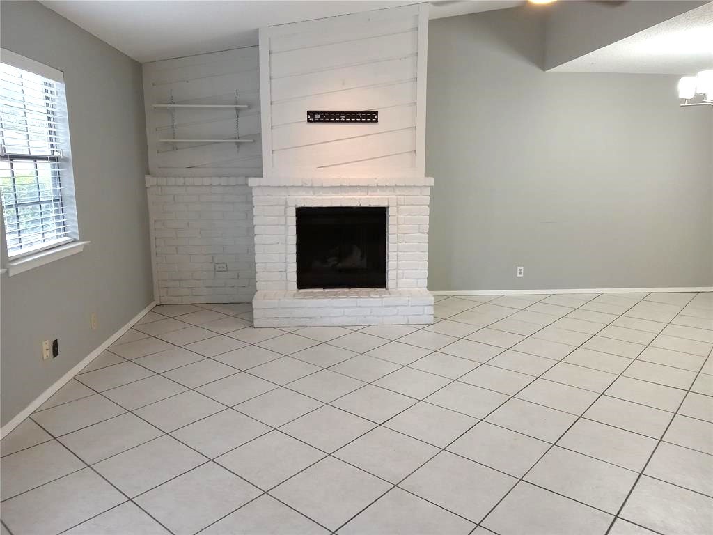 910 East Meadowmere Lane Austin, TX 78758 - Photo 3 of 27 a view of an empty room with a fireplace