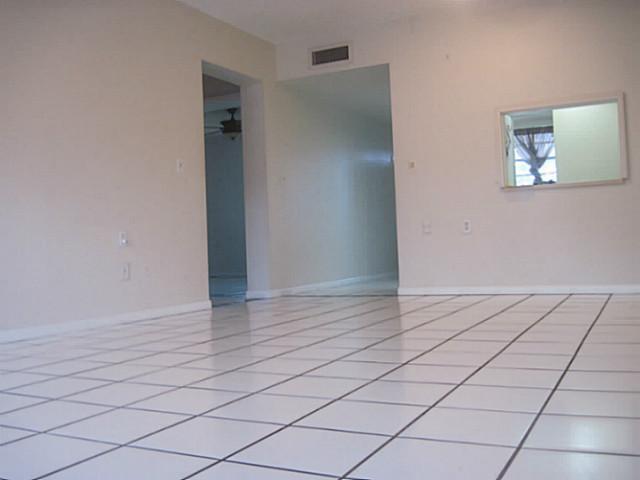 1900 South Kanner Highway, Unit 3104 Stuart, FL 34994 - Photo 17 of 20 a view of an empty room and wooden floor