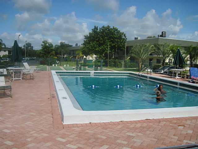 1900 South Kanner Highway, Unit 3104 Stuart, FL 34994 - Photo 4 of 20 a view of a swimming pool with a yard