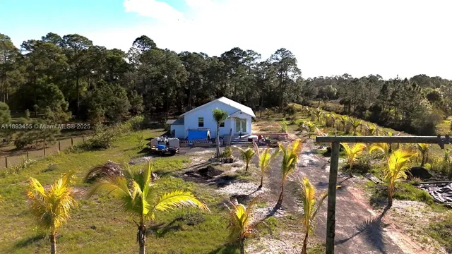 a view of swimming pool with a yard and seating area