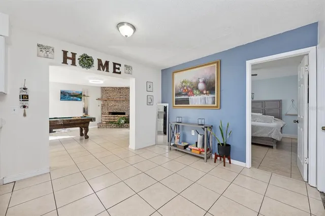 a view of living room filled with furniture and air conditioner