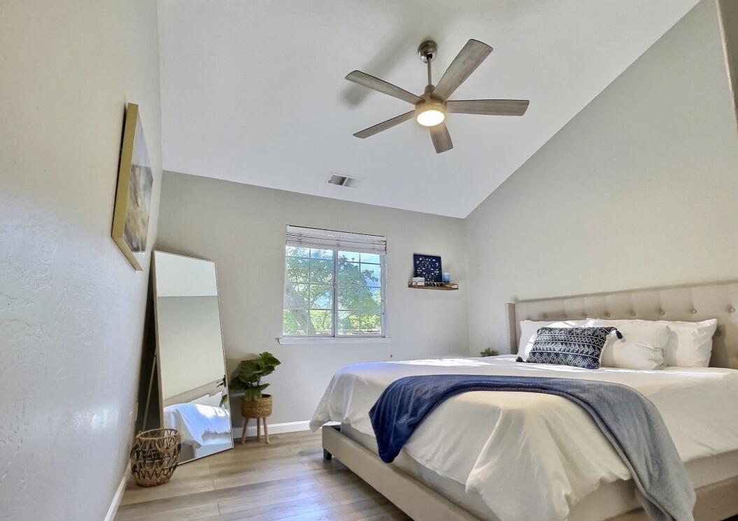 45233 Mineral King Road Three Rivers, CA 93271 - Photo 12 of 39 a bedroom with a bed and a chandelier