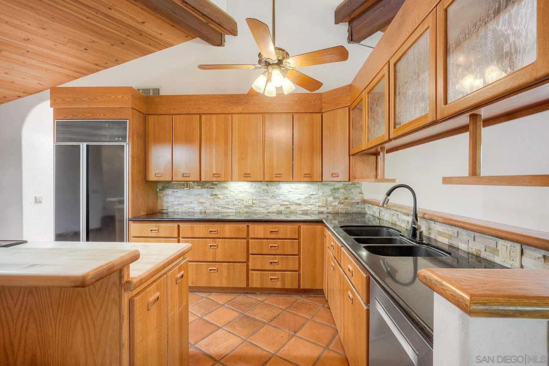 30458 Cool Valley Highlands Road Valley Center, CA 92082 - Photo 27 of 47 a kitchen with stainless steel appliances granite countertop a sink and cabinets