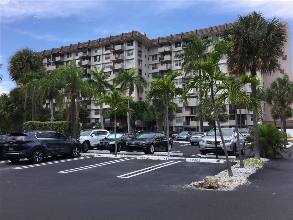 777 South Federal Highway, Unit 511RP Pompano Beach, FL 33062 - Photo 1 of 37 a city street lined with buildings and cars