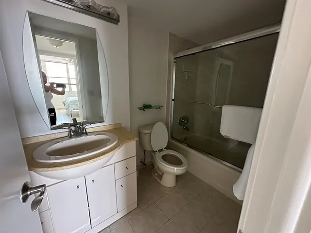 a living room with lots of furniture and white walls