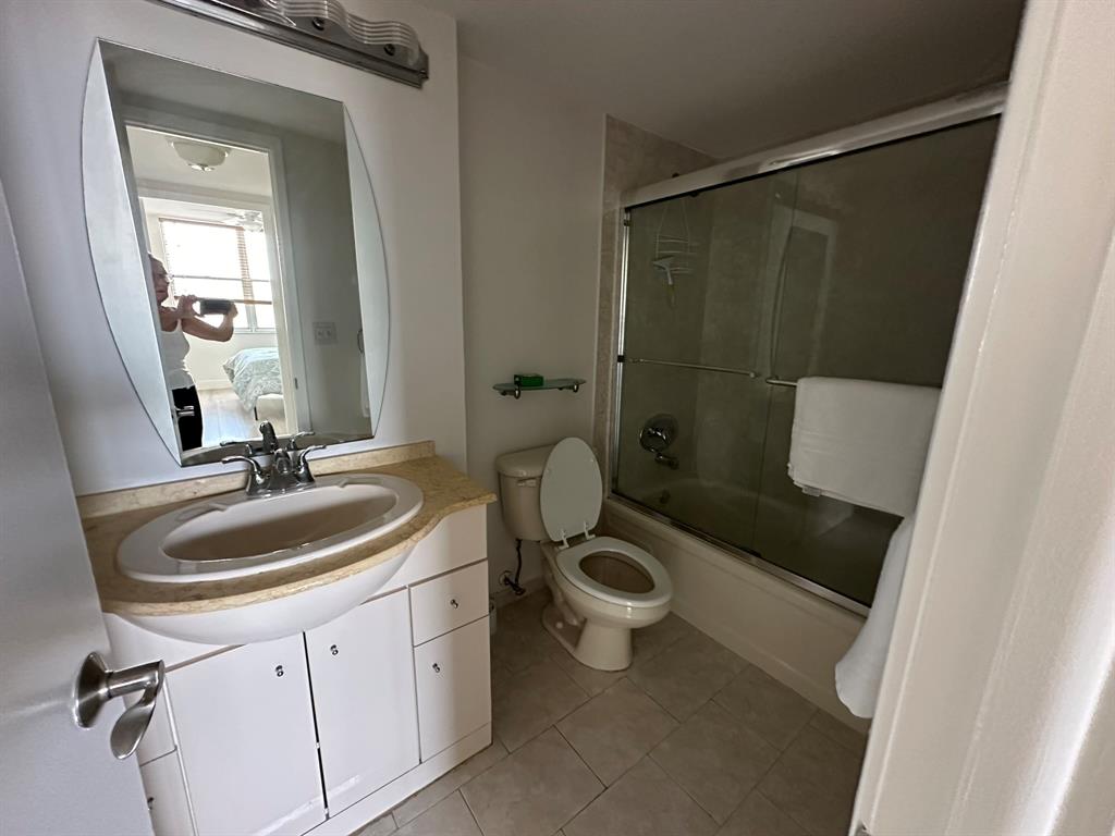 777 South Federal Highway, Unit 511RP Pompano Beach, FL 33062 - Photo 12 of 37 a bathroom with a sink toilet and shower