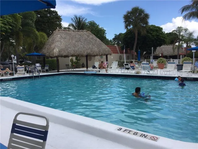 a view of a swimming pool with a patio