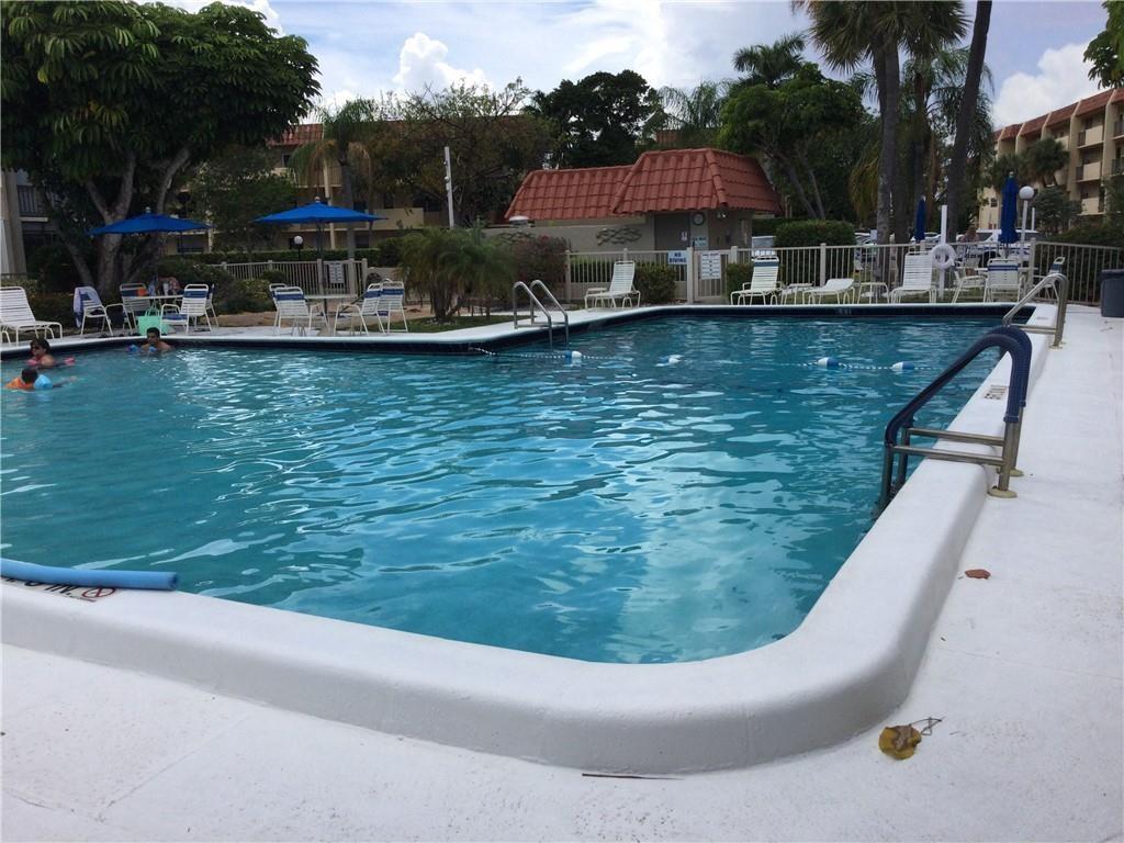 777 South Federal Highway, Unit 511RP Pompano Beach, FL 33062 - Photo 18 of 37 a view of a swimming pool with a patio