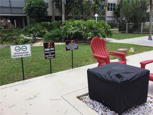 a view of a porch with chairs and couches