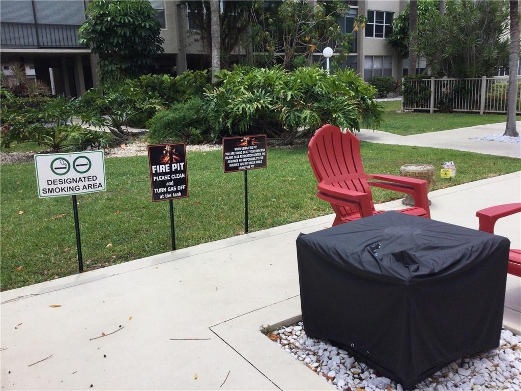 777 South Federal Highway, Unit 511RP Pompano Beach, FL 33062 - Photo 24 of 37 a wooden bench sitting in front of a building