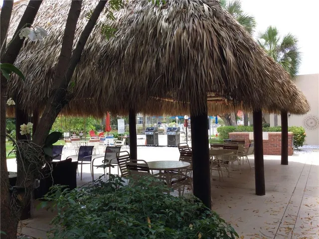 a view of a park with swings and slides