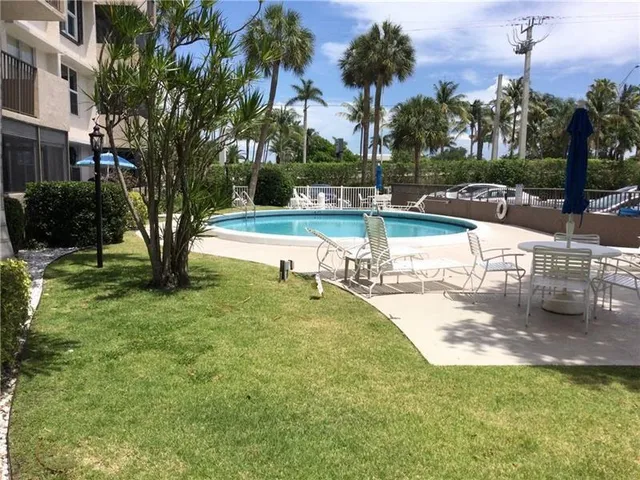 a view of a swimming pool with a patio
