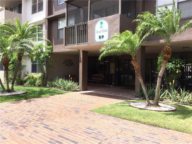 777 South Federal Highway, Unit 511RP Pompano Beach, FL 33062 - Photo 32 of 37 a front view of a house having yard