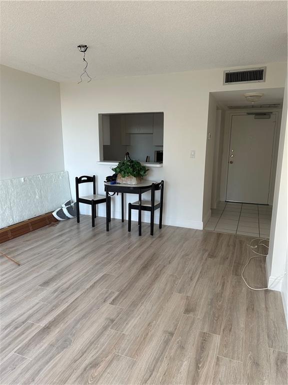 777 South Federal Highway, Unit 511RP Pompano Beach, FL 33062 - Photo 6 of 37 a view of a livingroom with furniture and wooden floor