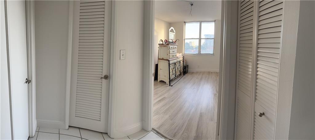 777 South Federal Highway, Unit 511RP Pompano Beach, FL 33062 - Photo 7 of 37 a view of entryway with wooden floor and cabinet