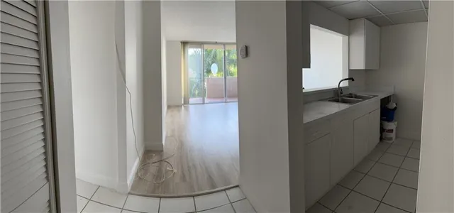 a kitchen with a sink and cabinets