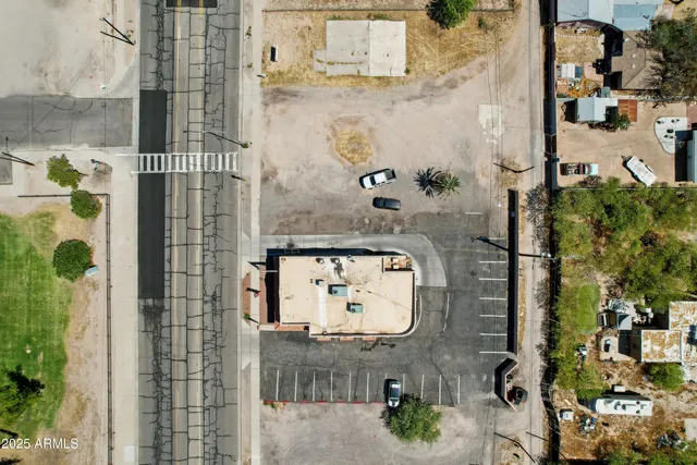 an aerial view of residential houses with outdoor space