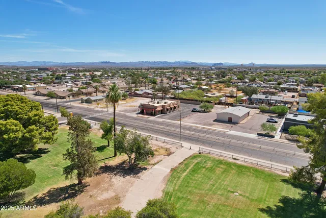 an aerial view of residential houses with outdoor space