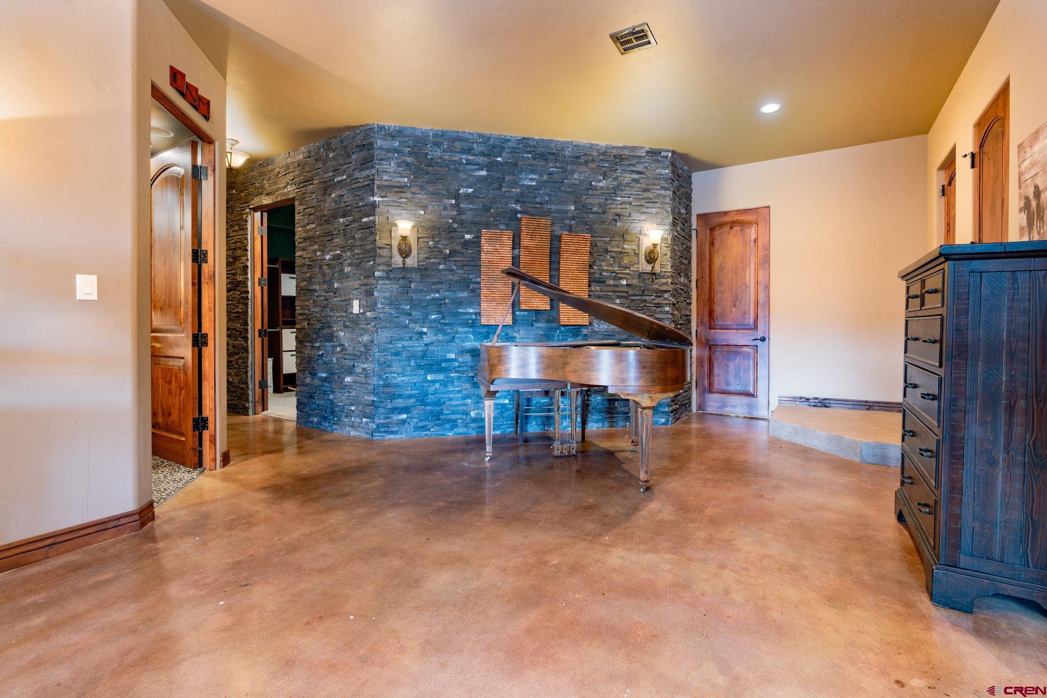 358 High Desert Road Grand Junction, CO 81507 - Photo 24 of 42 a view of livingroom with furniture and staircase