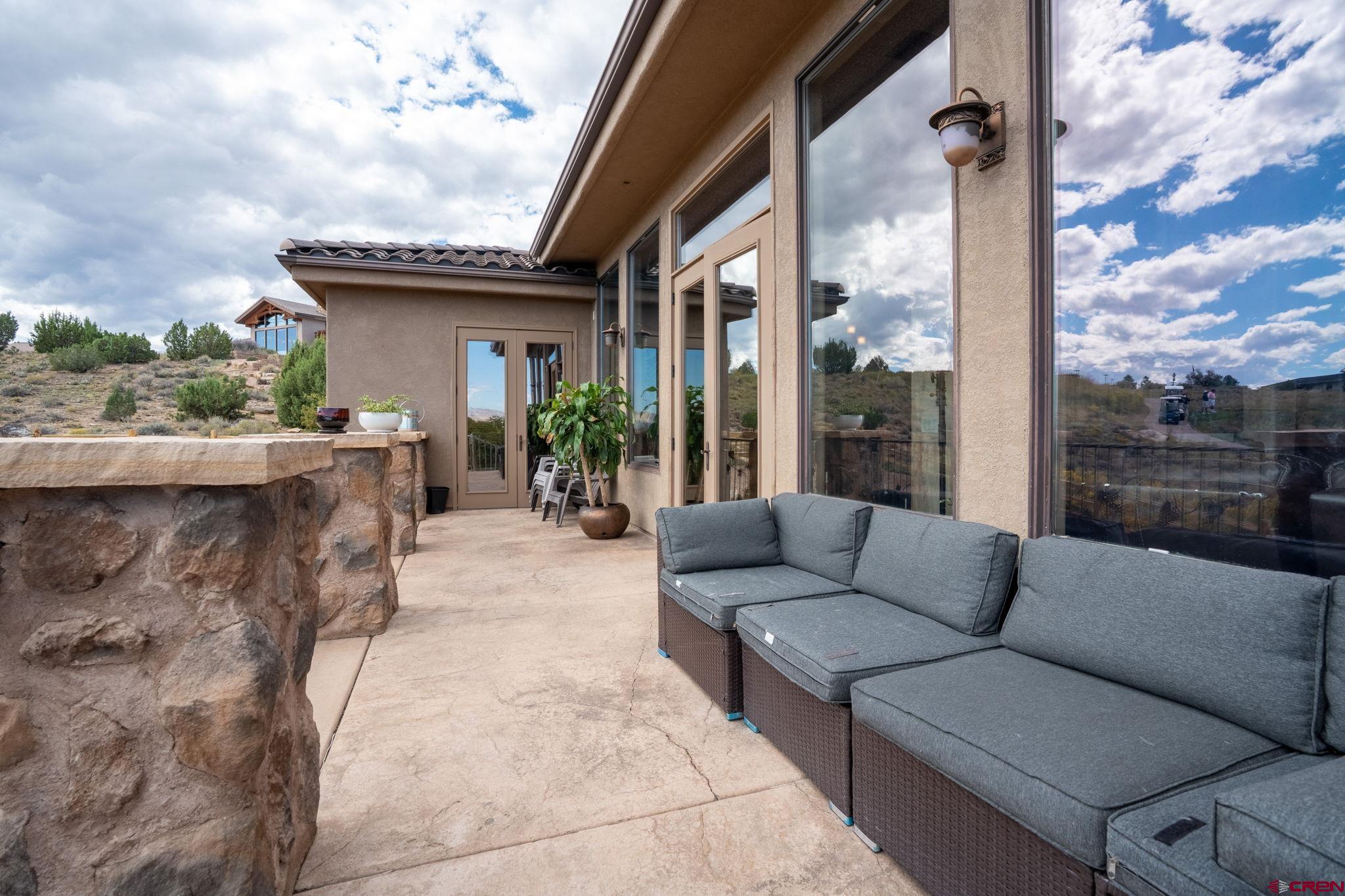 358 High Desert Road Grand Junction, CO 81507 - Photo 35 of 42 a view of a patio with couches and a fire pit