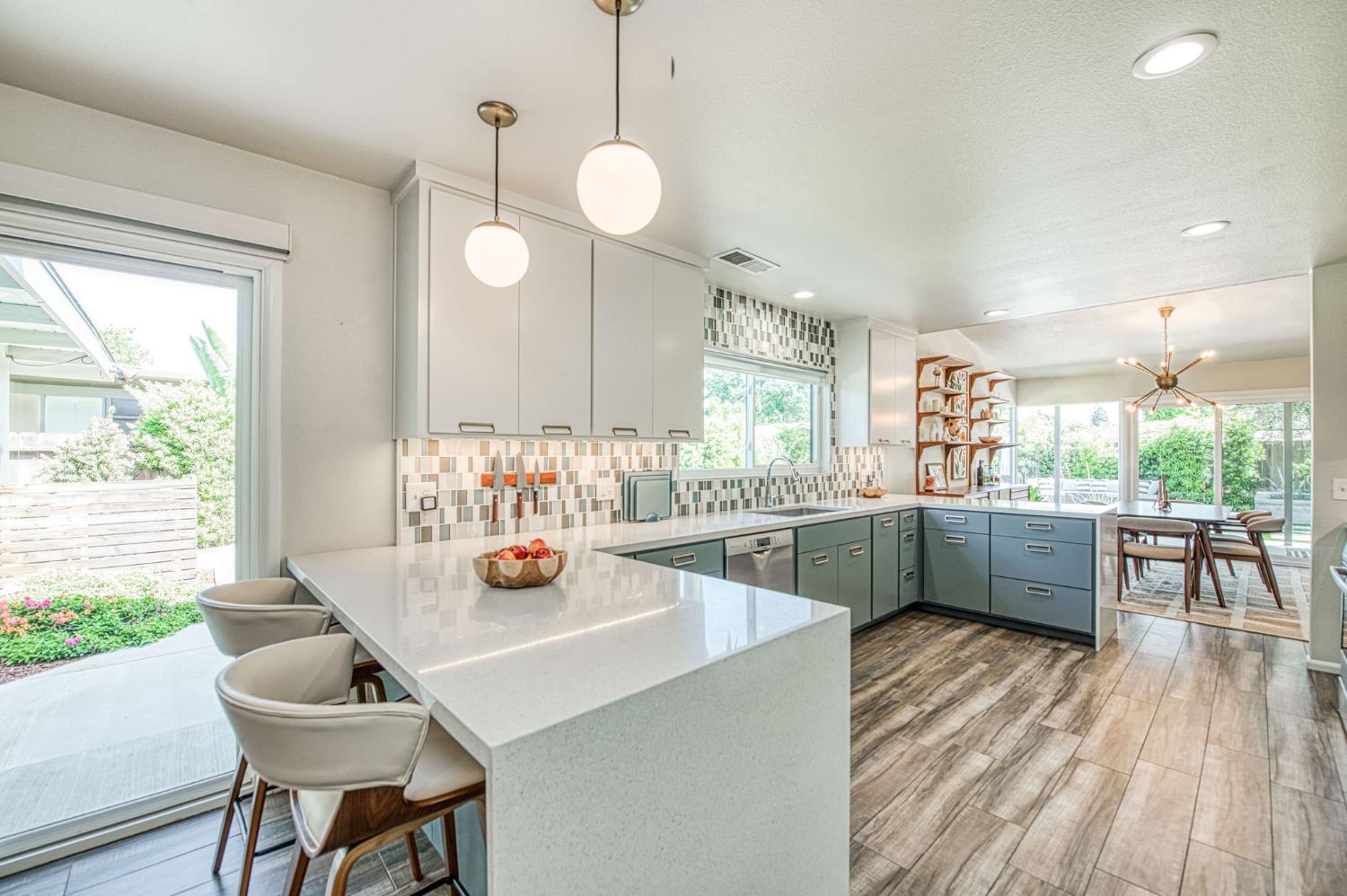 1527 West San Ramon Avenue Fresno, CA 93711 - Photo 14 of 55 a kitchen with a dining table chairs and window