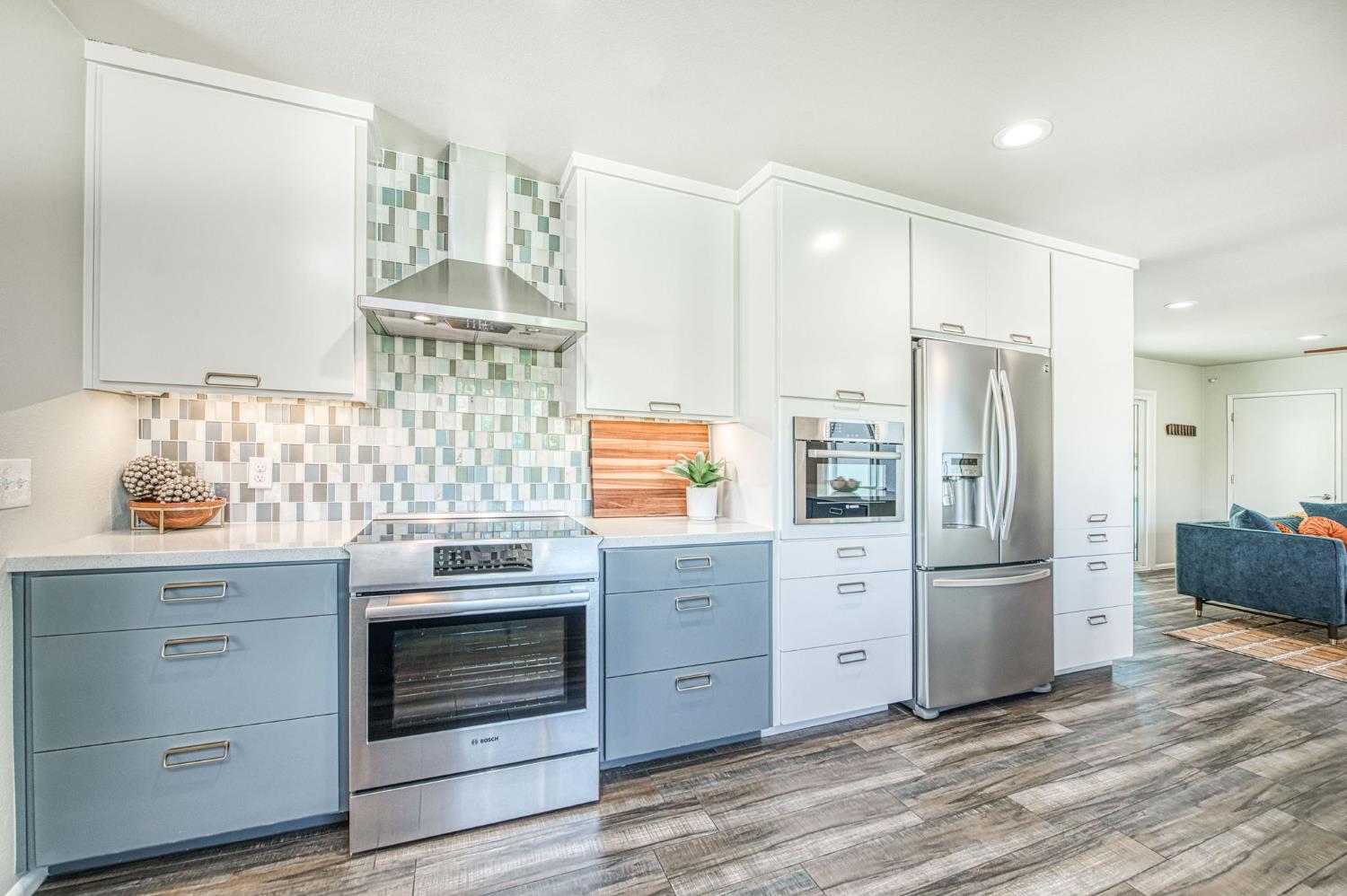 1527 West San Ramon Avenue Fresno, CA 93711 - Photo 18 of 55 a kitchen with stainless steel appliances granite countertop a refrigerator and a stove top oven