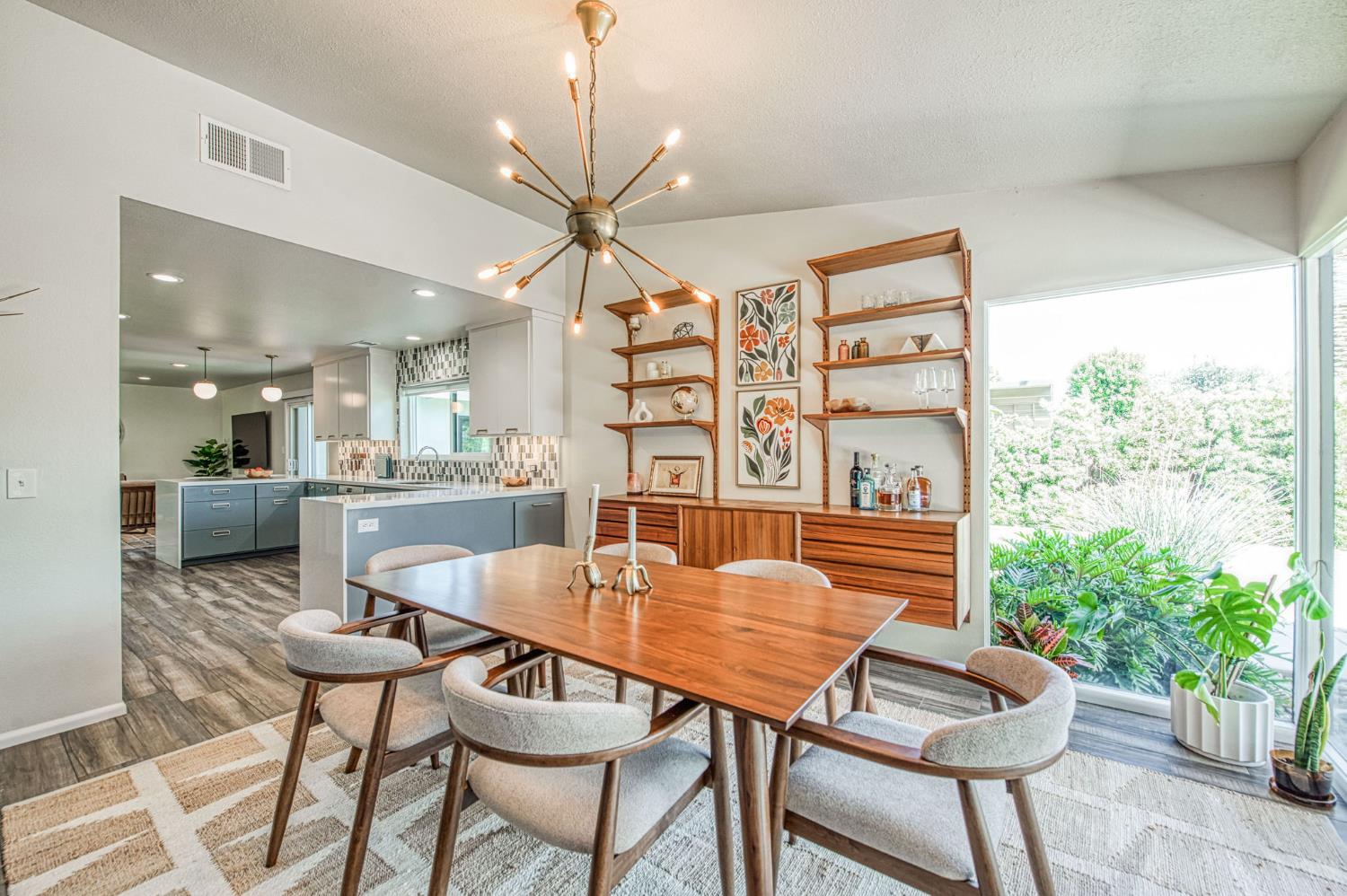 1527 West San Ramon Avenue Fresno, CA 93711 - Photo 20 of 55 a dining room with furniture and wooden floor