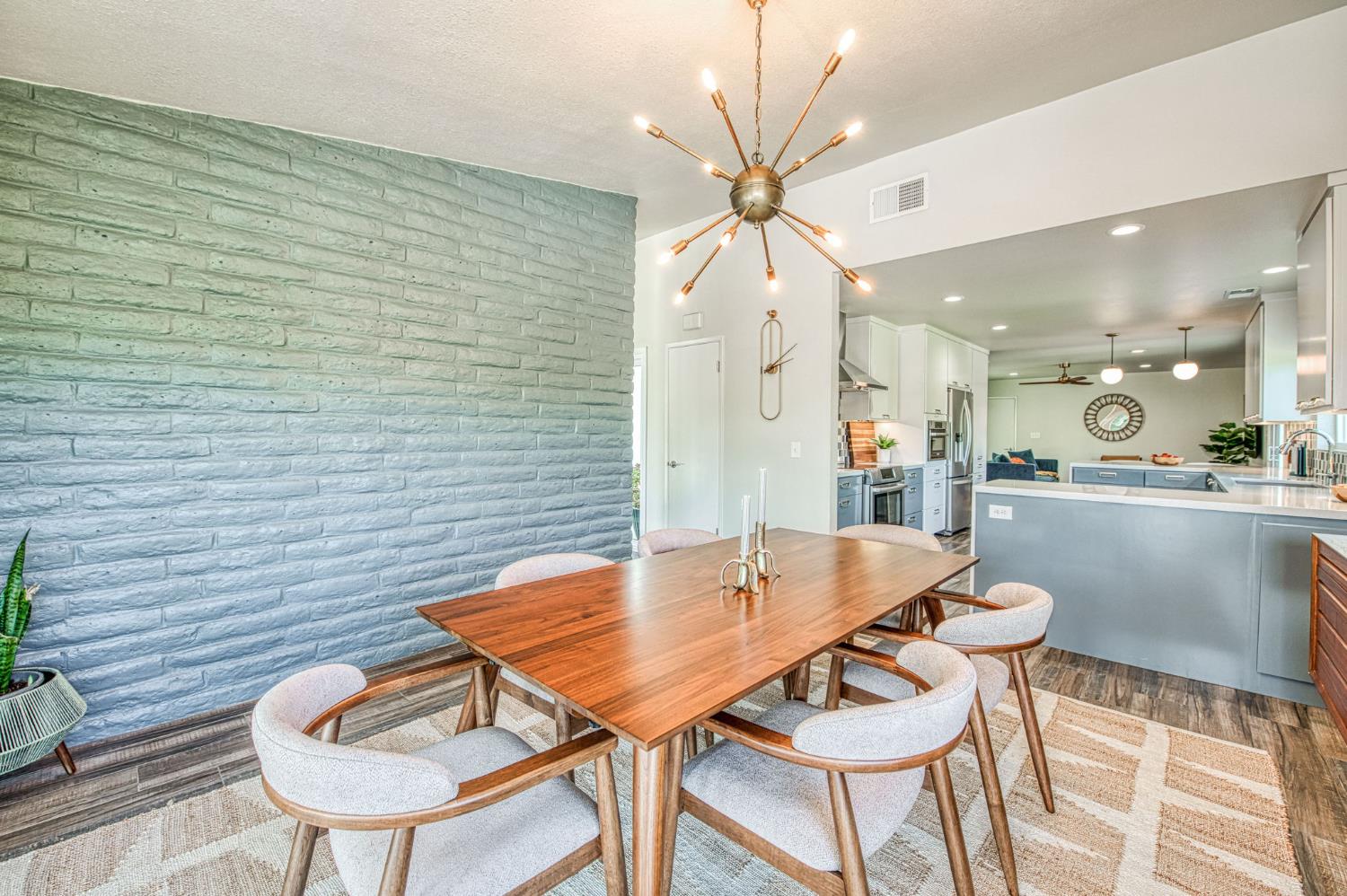 1527 West San Ramon Avenue Fresno, CA 93711 - Photo 21 of 55 a dining room with furniture and wooden floor