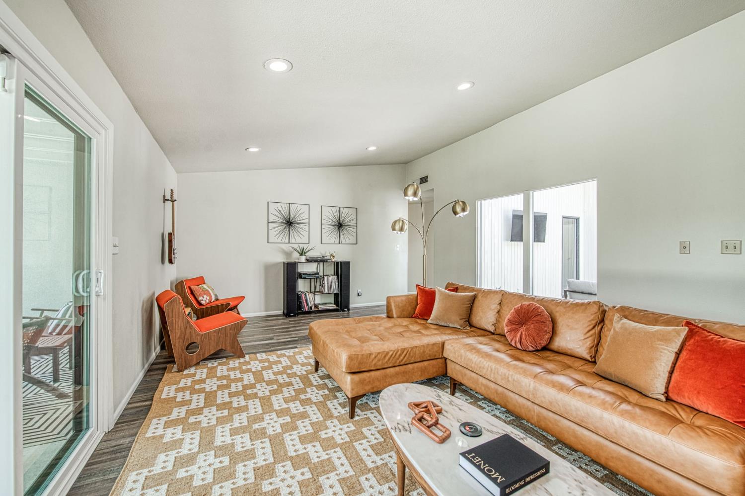 1527 West San Ramon Avenue Fresno, CA 93711 - Photo 27 of 55 a living room with furniture and wooden floor