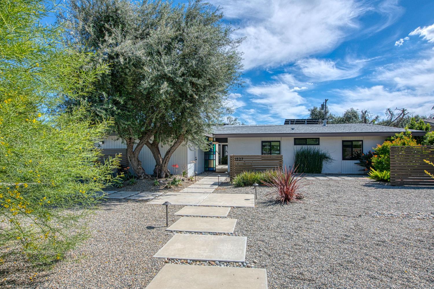 1527 West San Ramon Avenue Fresno, CA 93711 - Photo 3 of 55 a view of a house with backyard