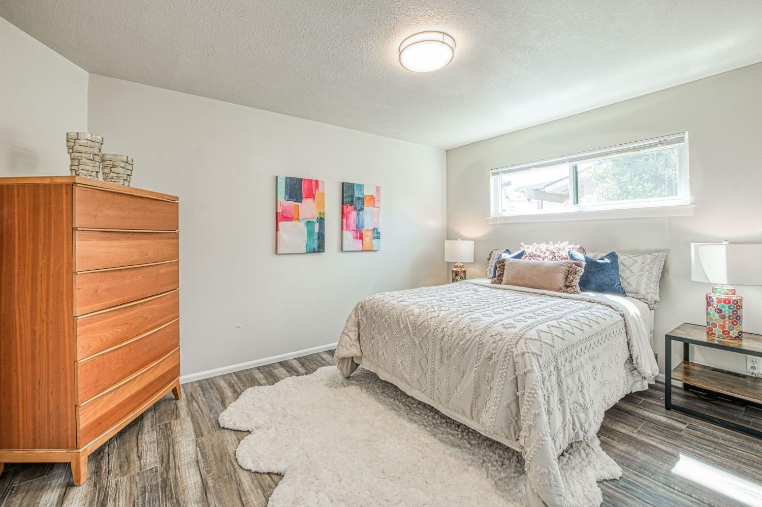 1527 West San Ramon Avenue Fresno, CA 93711 - Photo 32 of 55 a bedroom with a bed and a window