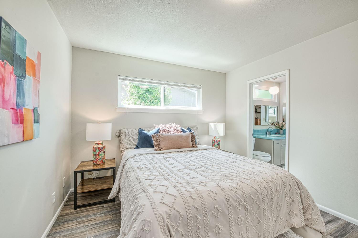 1527 West San Ramon Avenue Fresno, CA 93711 - Photo 33 of 55 a bedroom with a bed and a window