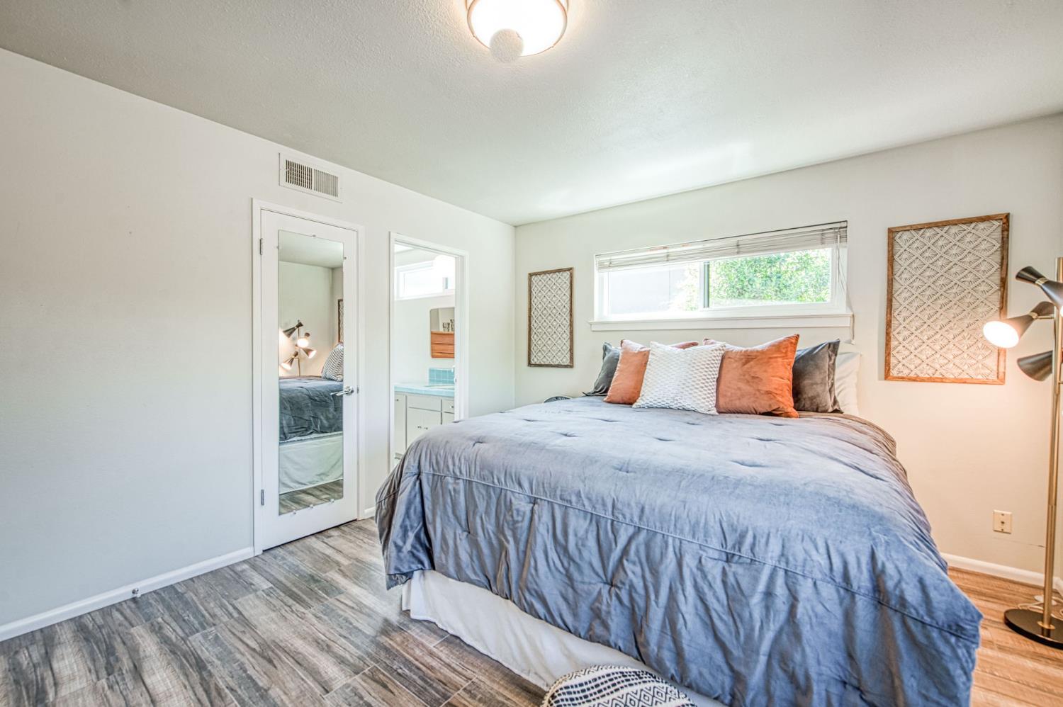 1527 West San Ramon Avenue Fresno, CA 93711 - Photo 36 of 55 a bedroom with a bed and a window