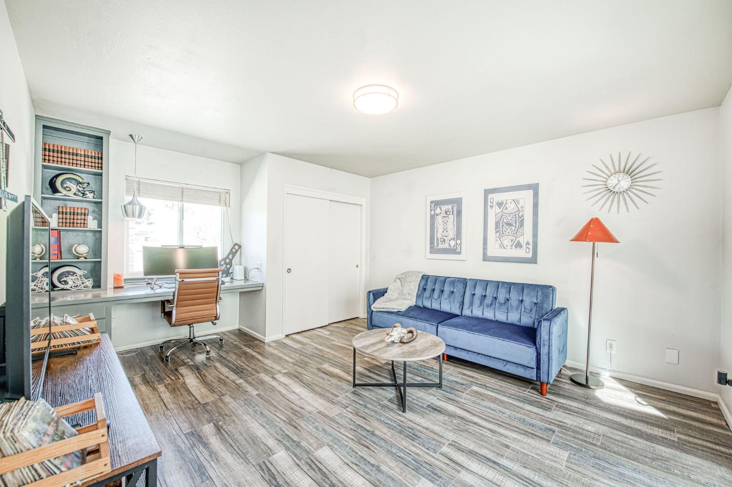 1527 West San Ramon Avenue Fresno, CA 93711 - Photo 37 of 55 a living room with furniture and a wooden floor