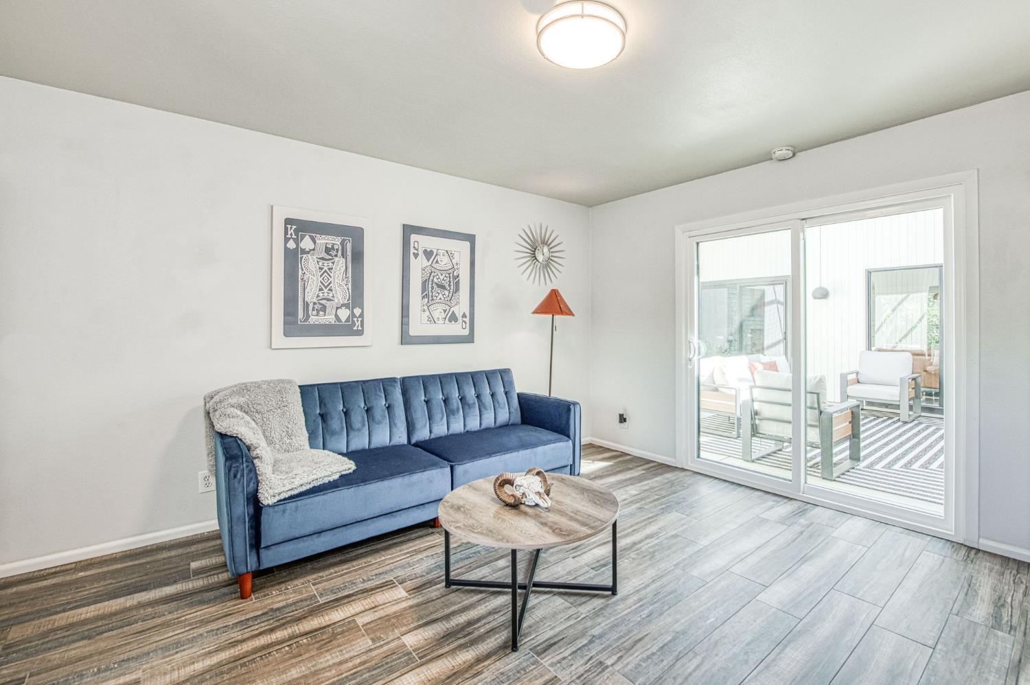 1527 West San Ramon Avenue Fresno, CA 93711 - Photo 38 of 55 a living room with furniture and a wooden floor