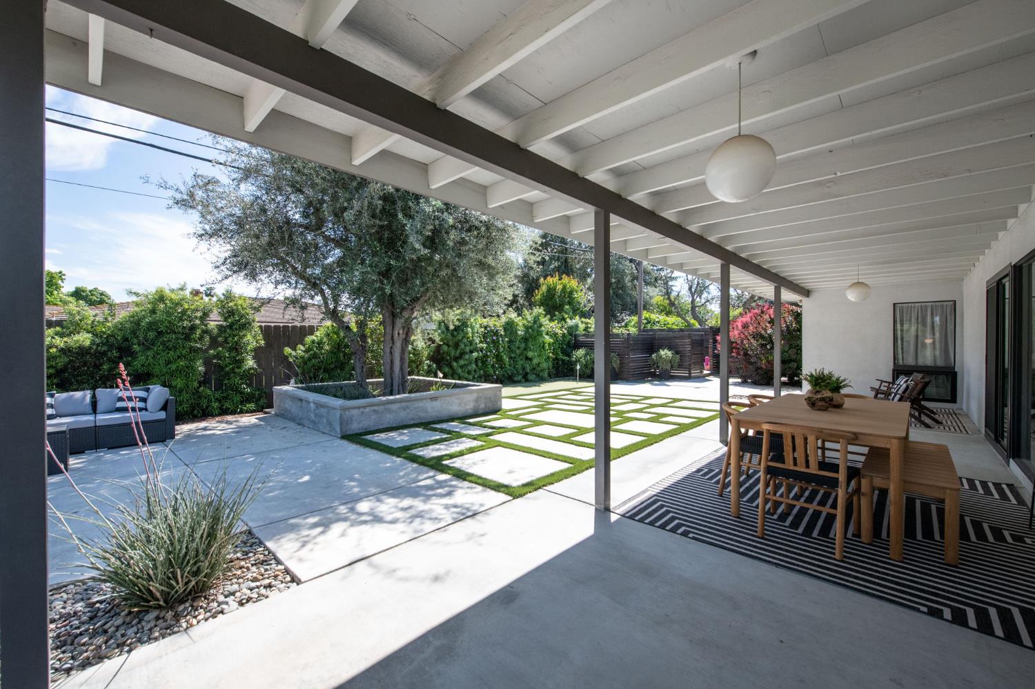 1527 West San Ramon Avenue Fresno, CA 93711 - Photo 44 of 55 a view of a porch with chairs and backyard