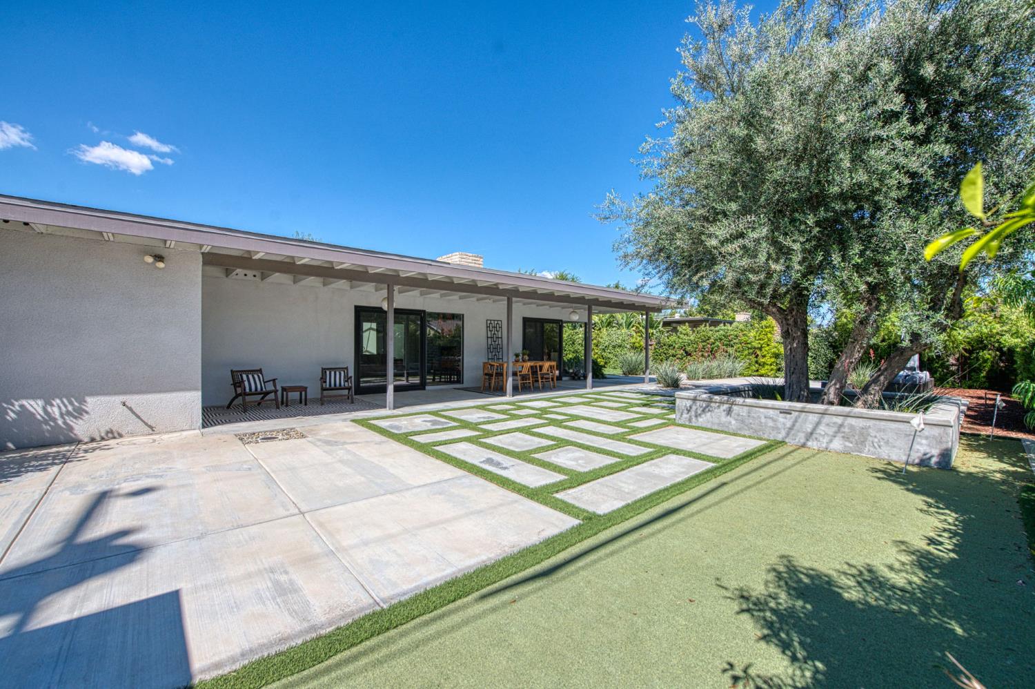 1527 West San Ramon Avenue Fresno, CA 93711 - Photo 48 of 55 a view of a house with swimming pool and sitting area
