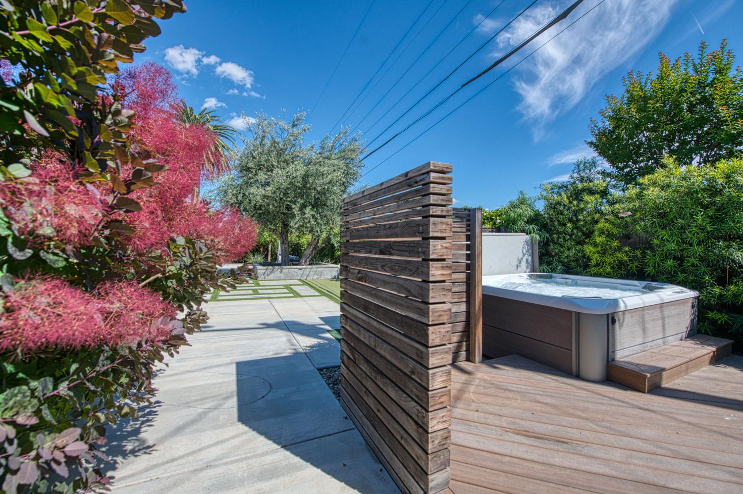 1527 West San Ramon Avenue Fresno, CA 93711 - Photo 50 of 55 a view of a patio and dinning table and chairs on the wooden floor