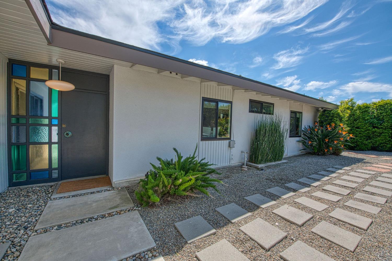 1527 West San Ramon Avenue Fresno, CA 93711 - Photo 5 of 55 a front view of a house with garden