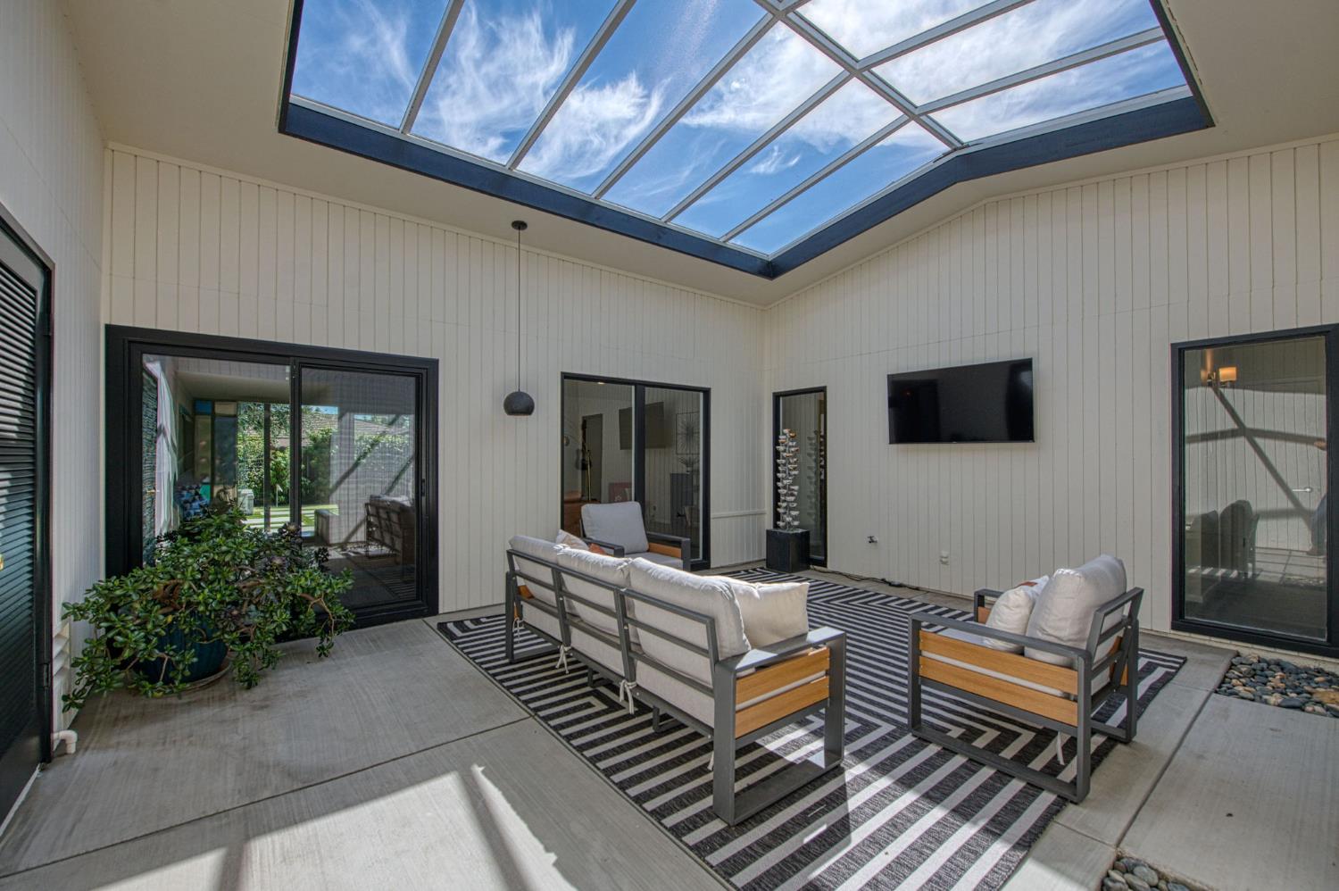 1527 West San Ramon Avenue Fresno, CA 93711 - Photo 6 of 55 a building outdoor space with patio furniture