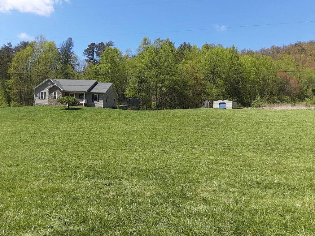 6267 Dillons Mill Road Callaway, VA 24067 - Photo 22 of 24 a view of a field with a house in the background