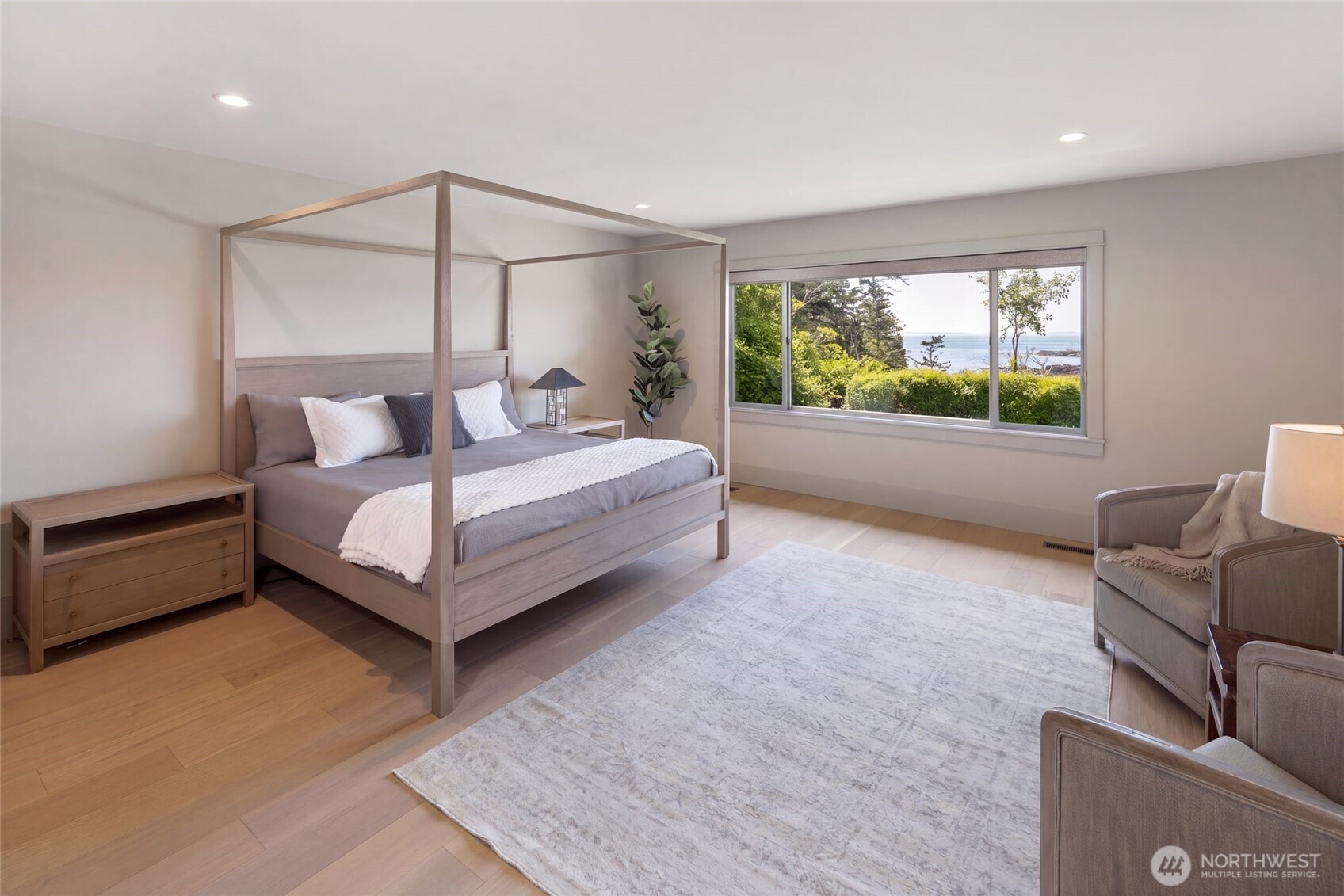 1248 Kanaka Bay Road Friday Harbor, WA 98250 - Photo 17 of 37 a spacious bedroom with a bed and glass window
