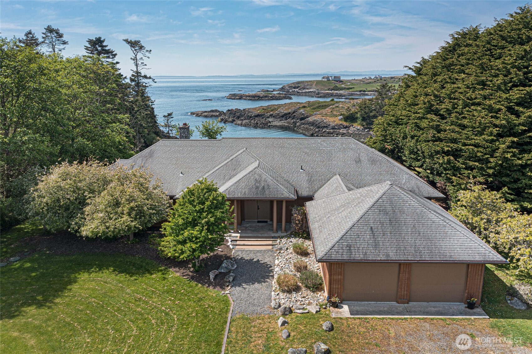 1248 Kanaka Bay Road Friday Harbor, WA 98250 - Photo 2 of 37 an aerial view of a house with a yard basket ball court and outdoor seating