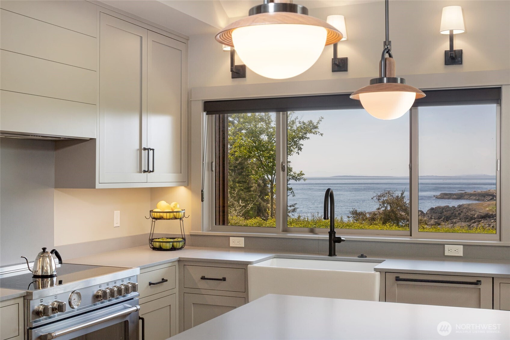 1248 Kanaka Bay Road Friday Harbor, WA 98250 - Photo 9 of 37 a kitchen with a stove a sink and a large window