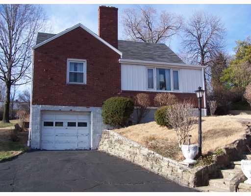 1438 Greentree Road Pittsburgh, PA 15220 - Photo 1 of 12 Exterior Front. House sits back off the road with extra parking and a turn-around in the driveway